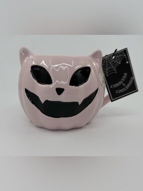 Pink Ceramic Halloween Cat Mug with Black Face Design by Cobwebs & Cauldrons